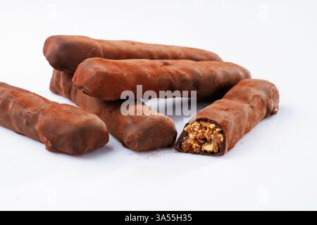 Chocolate bars lie on a white surface, isolated. Stock Photo