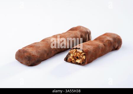 Chocolate bars lie on a white surface, isolated. Stock Photo