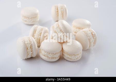 Bunch of macarons on the white surface. Stock Photo