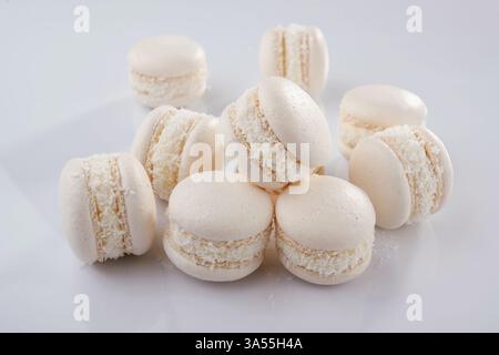 Bunch of macarons on the white surface. Stock Photo