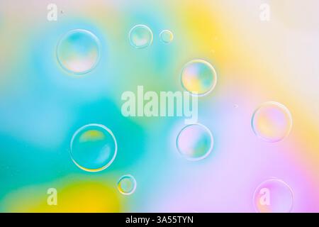 Abstract background with large round bubbles on a blurred background of pastel colors. Bubbles create an effect of volume and depth, and soft color tr Stock Photo