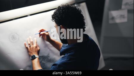 Architect, blueprint or night with construction design or drawing for building plan, document or architecture. Male person, civil engineer or working Stock Photo