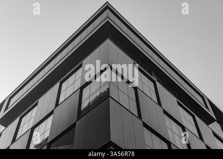 Contemporary Architectural Design Featuring Modern Facade and Glass Elements. Architectural lines and geometric patterns. Glass facade Modern building Stock Photo