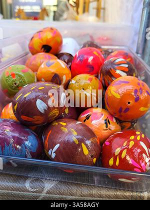 Background painted wooden Easter décor in the form of colorful Easter eggs Stock Photo
