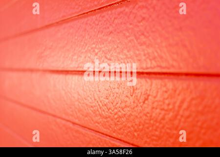 A view of an orange painted concrete wall, as a background. Stock Photo