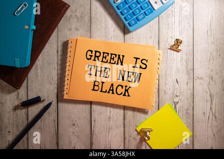 Dark teal emerald green silk satin. Shiny smooth fabric. Soft folds. Luxury background with space for design. web banner. Flat lay, top view table. Bi Stock Photo