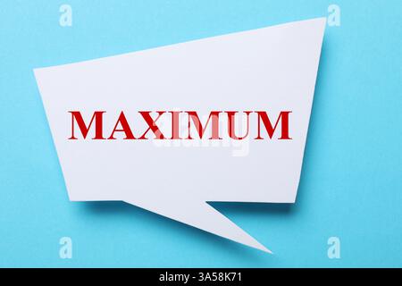Speech bubble with word Maximum on light blue background, top view Stock Photo