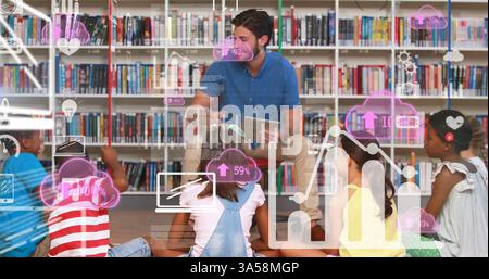 Teacher engaging diverse students with digital technology in library setting Stock Photo