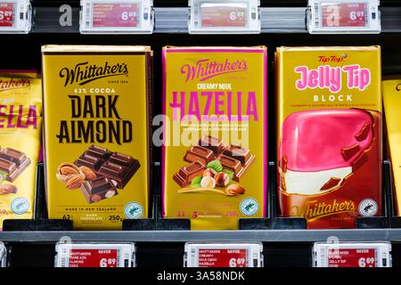 Whittaker's chocolate bars on supermarket shelf, 62% Cocoa Dark Almond, Creamy Milk Hazella, Tip Top Jelly Tip Block, Made in New Zealand, NZ Stock Photo