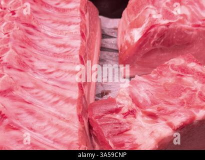 Raw pork meat ribs texture background. Fresh pork meat ribs for barbecue. Strip of pork meat on ribs. BBQ pork ribs Stock Photo