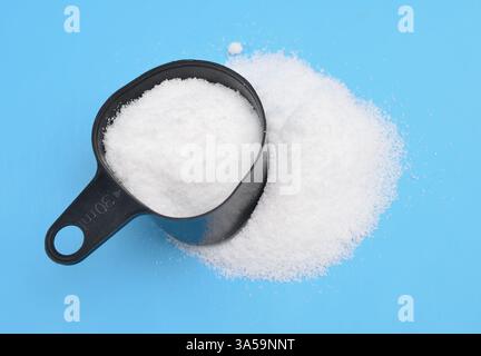 Thiourea powder on blue background Stock Photo