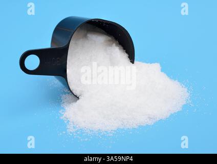 Thiourea powder on blue background Stock Photo