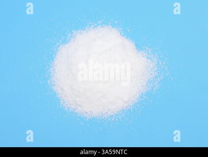 Thiourea powder on blue background Stock Photo