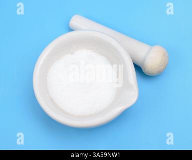 Thiourea powder on blue background Stock Photo
