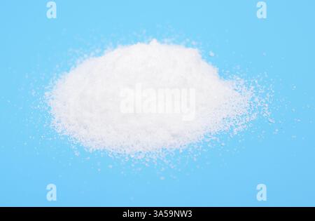 Thiourea powder on blue background Stock Photo