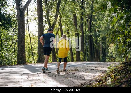 Jogging, conception of sport. Senior couple together outdoors at nature. Stock Photo