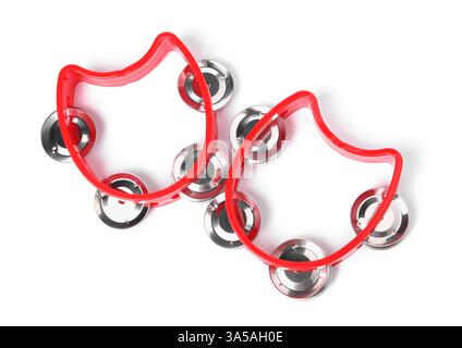 Red toy tambourines isolated on white, top view. Child's musical instrument Stock Photo