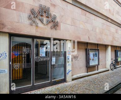 Freiburg, Germany - Feb 10, 2025: Exterior view of Freiburg Stadtarchiv building with emblem above the entrance doors, glass panels, notice board, gra Stock Photo