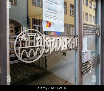 Freiburg, Germany - Feb 10, 2025: Close-up of Freiburg Stadtarchiv entrance door showing the decorative handle with emblematic city crest and letterin Stock Photo