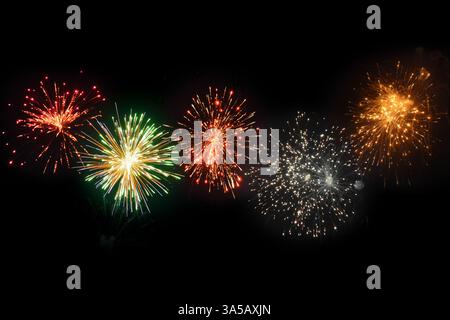 Five Vibrant Colourful Firework Bursts in Night Sky Stock Photo