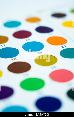 A detailed close-up shot of a vibrant color palette, showcasing a variety of hues and shades on a clean white background. Perfect for design projects, Stock Photo