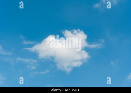 Fluffy white cloud float in bright blue sky on summer Stock Photo