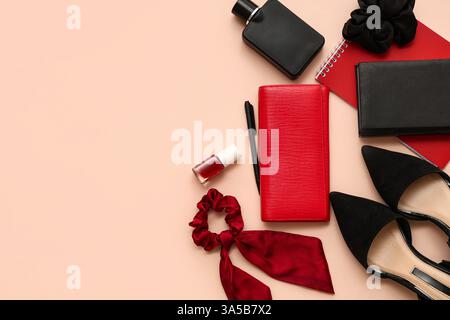 Composition with stylish female accessories, shoes and notebooks on color background Stock Photo