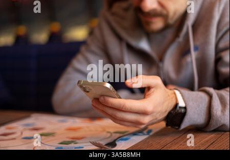 close up young man using smartphone Stock Photo