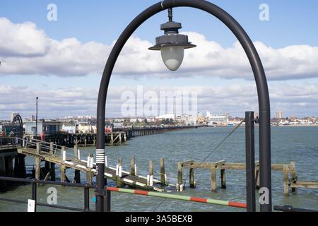 View of Southend and its southend pier through a lamp post arch, Essex England Stock Photo