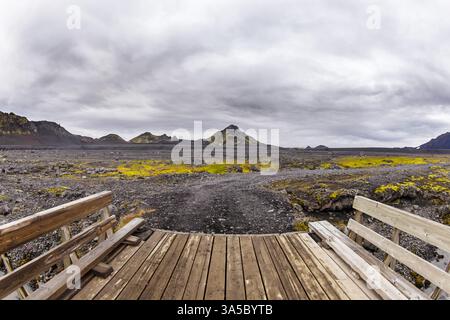 Breathtaking View of Icelandic Landscape Featuring Mountains, Lava Fields, and a Dramatic Cloudy Sky Framing an Expansive Rocky Terrain Near an Stock Photo