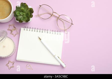 Paper clips, other different stationery, glasses, coffee and decor on lilac background, flat lay. Space for text Stock Photo