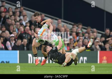 Saracens' Theo Dan is tackled by Harlequins' Lucas Schmid during the ...