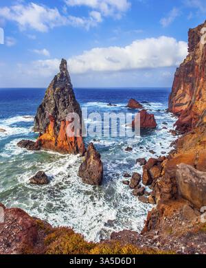 The blinding midday sun illuminates the rocky shore. The boiling ...
