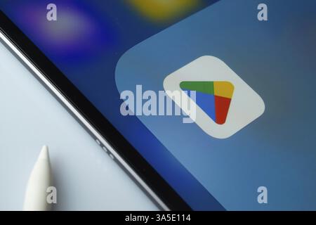 A close up of an iPad screen displaying the Google play app Stock Photo