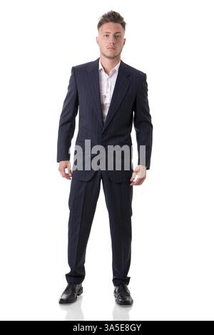 Full figure shot of handsome elegant young man with suit and neck-tie, isolated on white, looking at camera Stock Photo