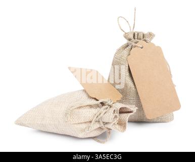 Burlap bags with tags isolated on white Stock Photo