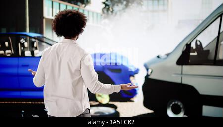 Man in blue suit calls insurance agent after auto accident. Young businessman in distress discusses car damage on phone Stock Photo