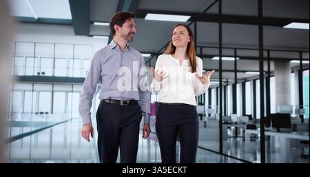Two directors collaborate online while enjoying a coffee break together. Stock Photo