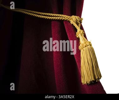 Red velvet curtain with tassel. Close up white isolated curtain Stock Photo