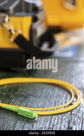 Device for mounting optical cable. Optical internet Technology concept. Optical fiber assembly Stock Photo