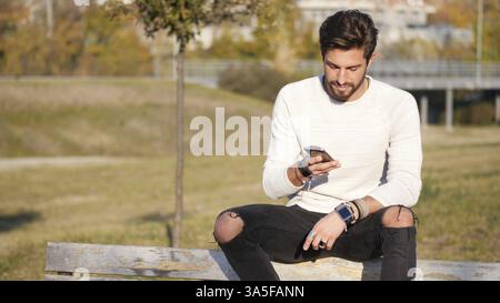 Handsome man making phone call outdoor in urban environment on with cell phone Stock Photo
