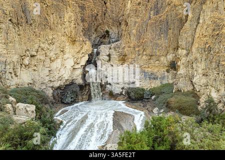 The famous biblical stream Kidron. Winter flood on the Kidron stream before flowing into the Dead Sea. The waterfall and a small lake were photographe Stock Photo