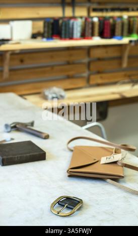 Tailor process leather in workshop. Making leather products Stock Photo
