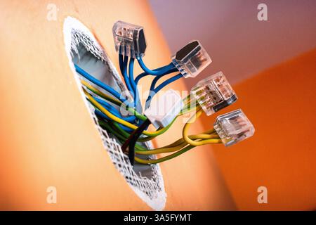 New cables in the wall.replacement of electrical wiring Stock Photo