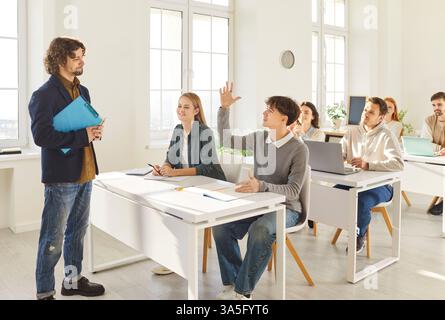 Teacher and students group in class during lesson, working and study in college trainee interns Stock Photo