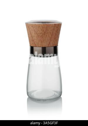 New empty glass professional pepper grinder isolated on white. Stock Photo