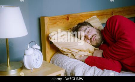 Man sleeping bed on a Vacation Morning Stock Photo