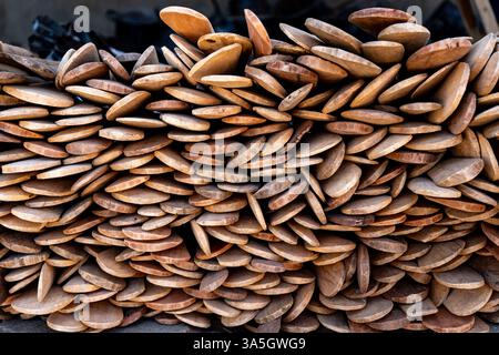 Stack of Handmade Wooden Kitchen Utensils – Tete, Mozambique Stock Photo