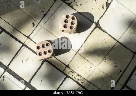 Two wooden dices on table Stock Photo