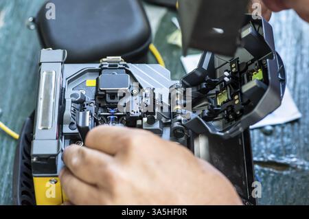 Device for mounting optical cable. Optical internet Technology concept. Optical fiber assembly Stock Photo